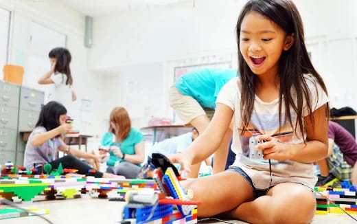 a young girl sitting on the floor