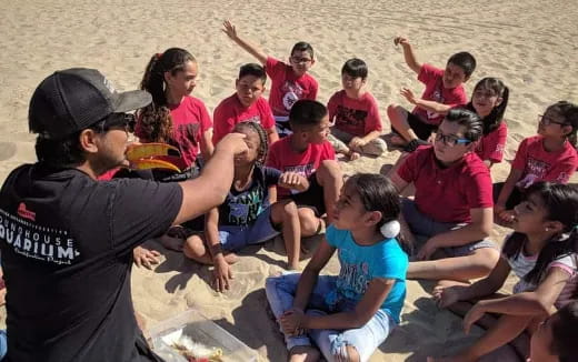 a group of people sitting on the ground