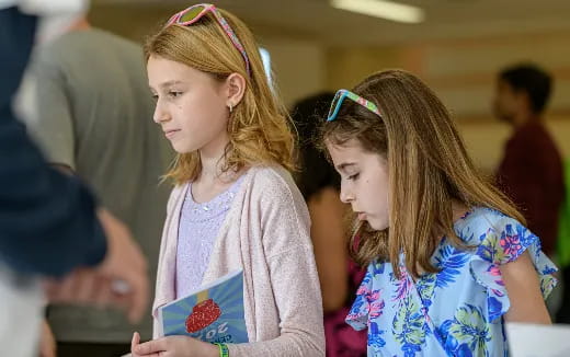 a couple of girls looking at each other
