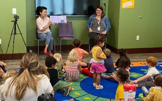 a person teaching children in a classroom