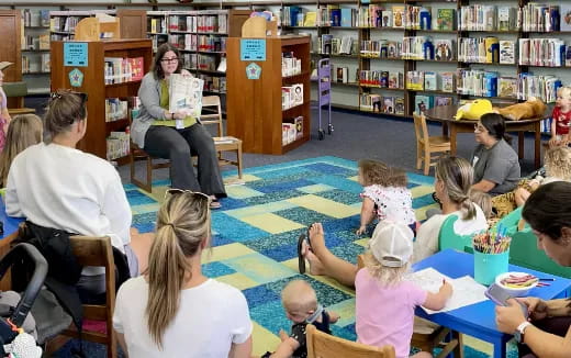 a group of people sitting in a library