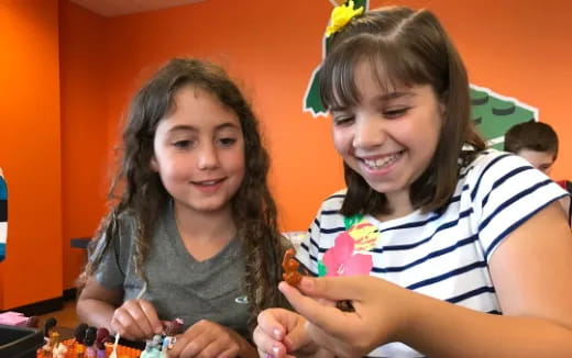 a couple of girls smiling