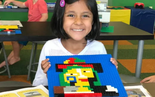 a girl holding a book