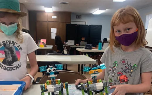 a couple of kids playing with toys