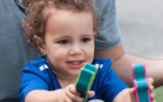 a child holding a toothbrush