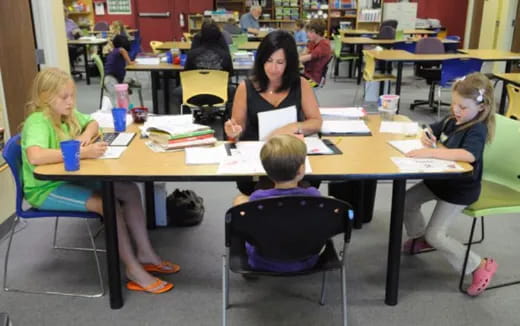 a group of people sitting at a table
