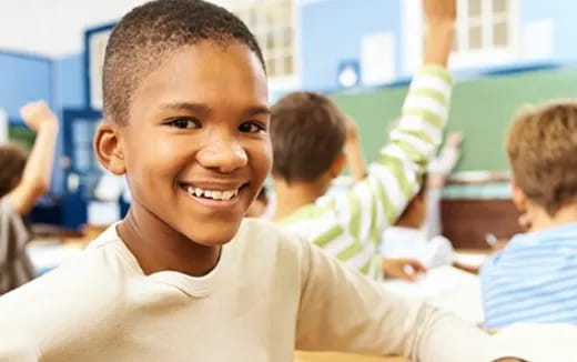 a close-up of a boy smiling