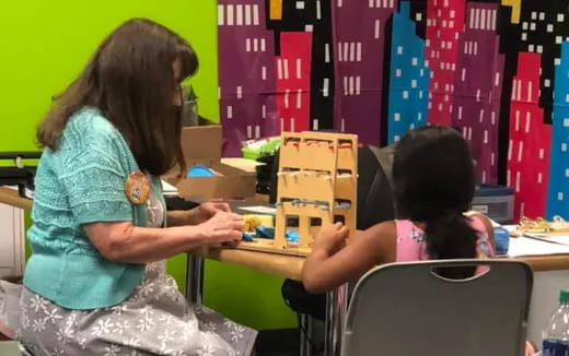 a few women sitting at a table