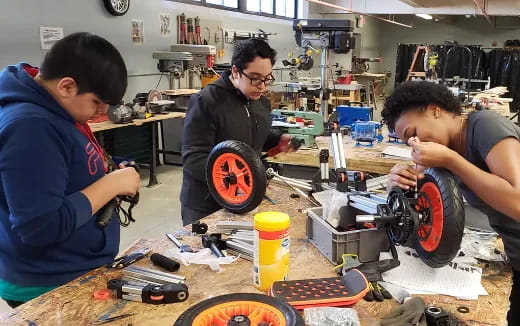 a group of men working on a machine