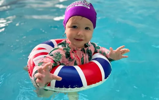 a baby in a pool