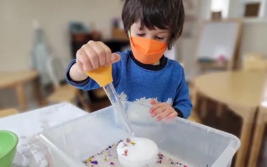 a kid eating cake