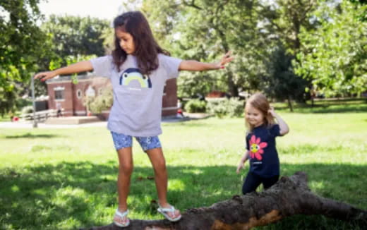 a person and a child playing in a park