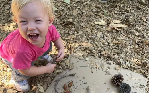 a child playing with rocks