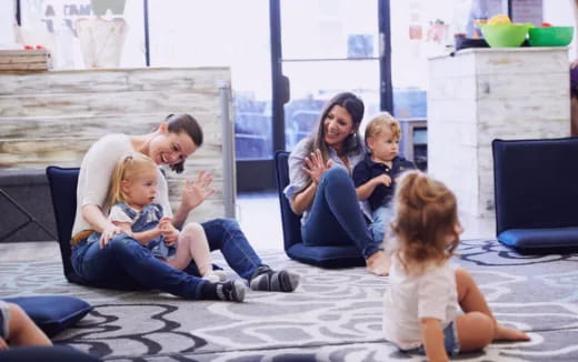 a group of people sitting on the floor