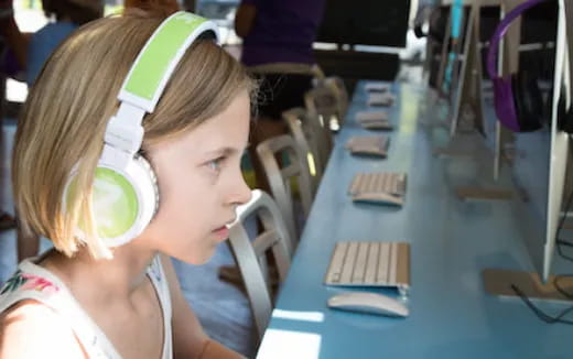 a young girl with headphones on