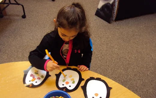 a child painting on a table