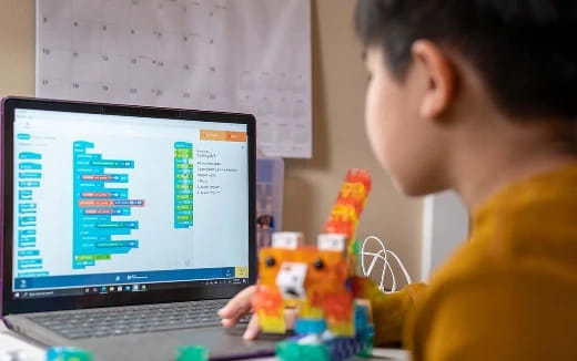 a boy using a laptop