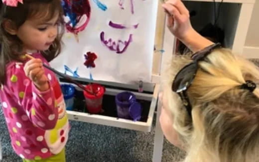 a young girl painting