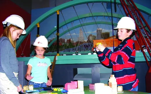a group of people wearing hard hats