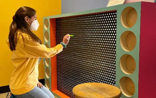 a person painting a wall