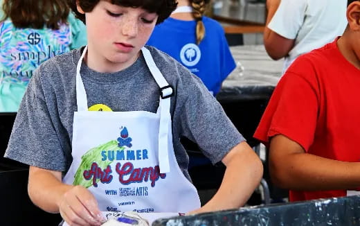 a boy holding a bag