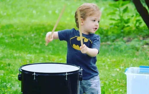 a child holding a stick