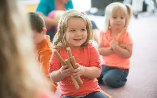 a few children holding pencils