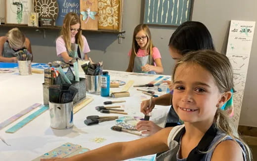 a group of children sitting at a table