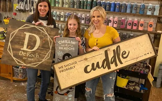 a group of women holding signs