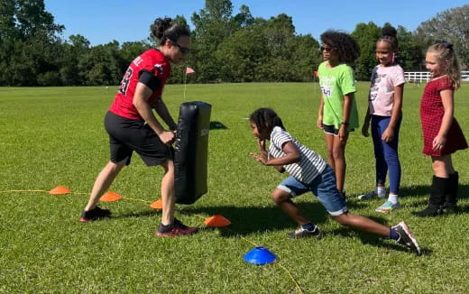 a group of kids playing frisbee
