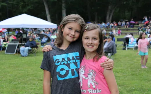 a boy and girl posing for a picture