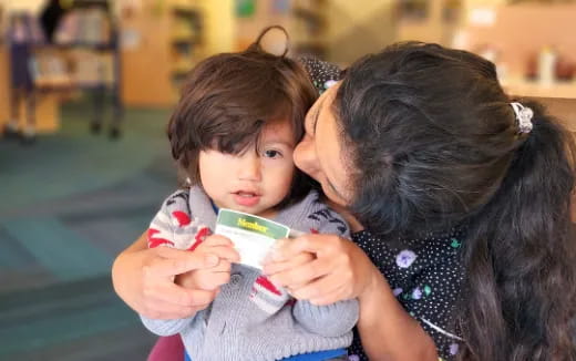 a person holding a baby