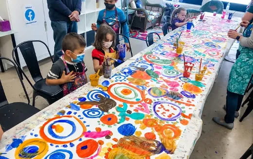 a group of children painting