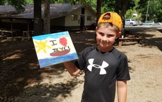 a boy holding a flag