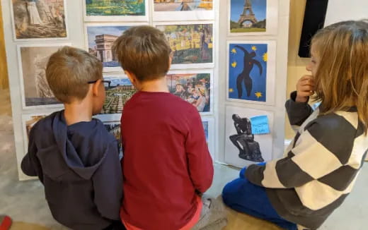 a group of people looking at art