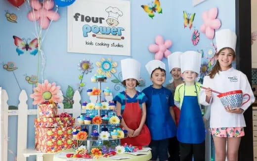 a group of children wearing white hats