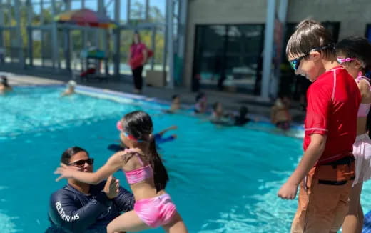 a group of people in a pool