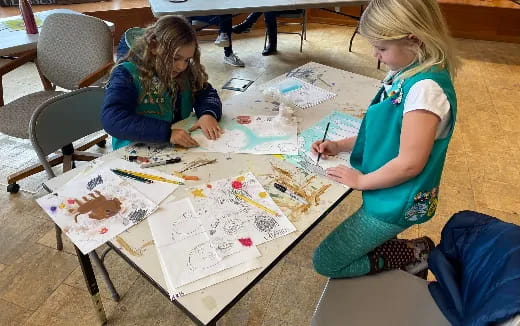 a few young girls painting