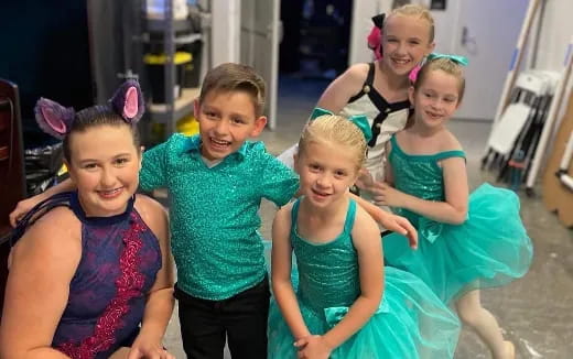 a group of children posing for a photo