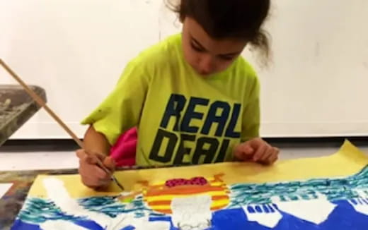 a young girl painting