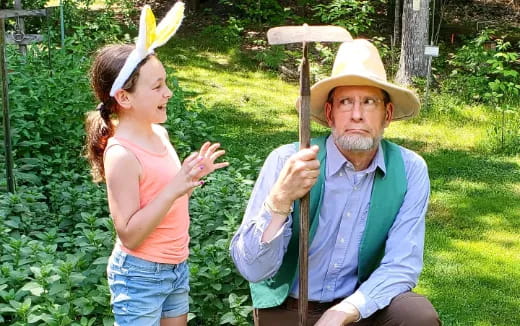 a person and a girl holding bananas