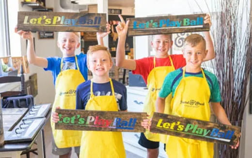 a group of boys wearing yellow shirts
