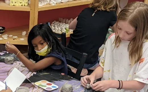 a person painting with a brush