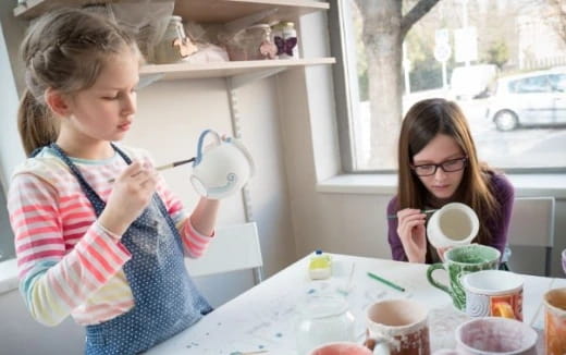 a young girl painting