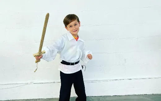 a boy holding a sword
