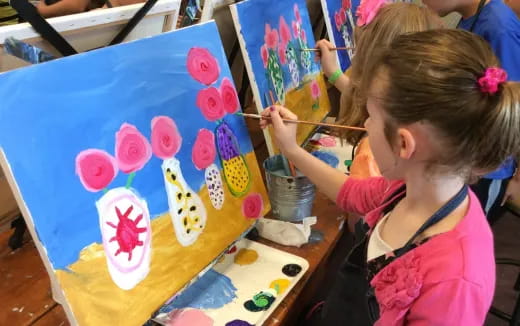 a young girl painting