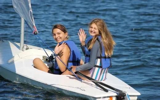 a couple of women on a boat