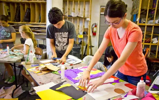 a group of children painting