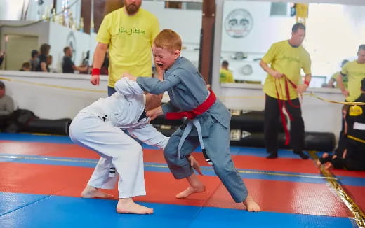 two boys in karate uniforms