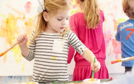 a young girl painting